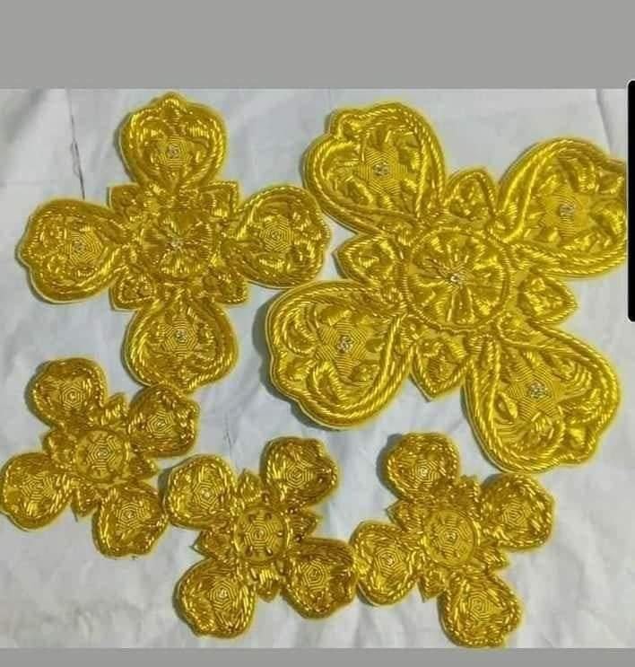 Gold corded flower crosses in five sizes