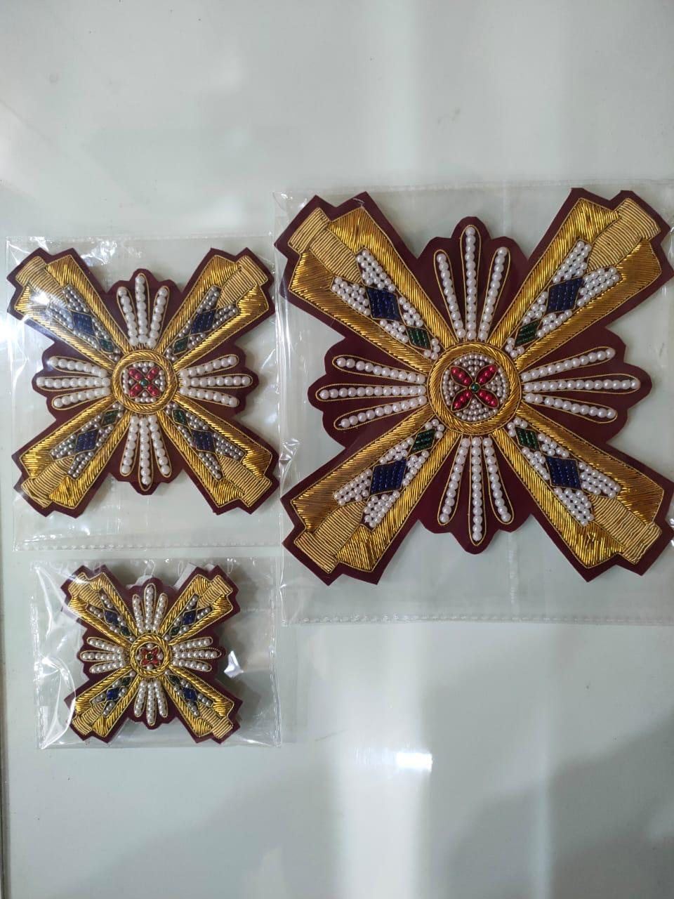 Pearl ray crosses in three sizes on maroon