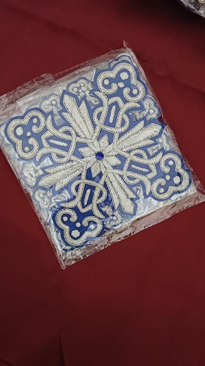 Silver on blue cross with sapphire centre
