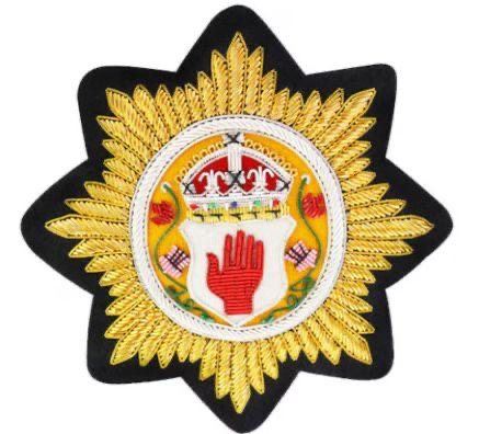 Eight point star plaque with red hand shield centre
