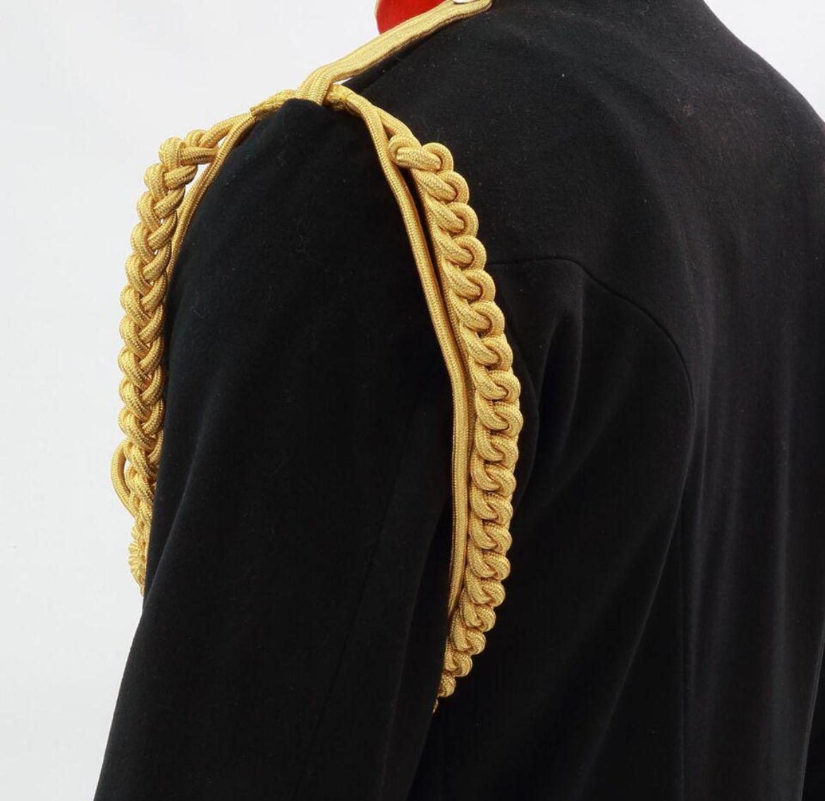 Gold shoulder cord and plait on a ceremonial tunic