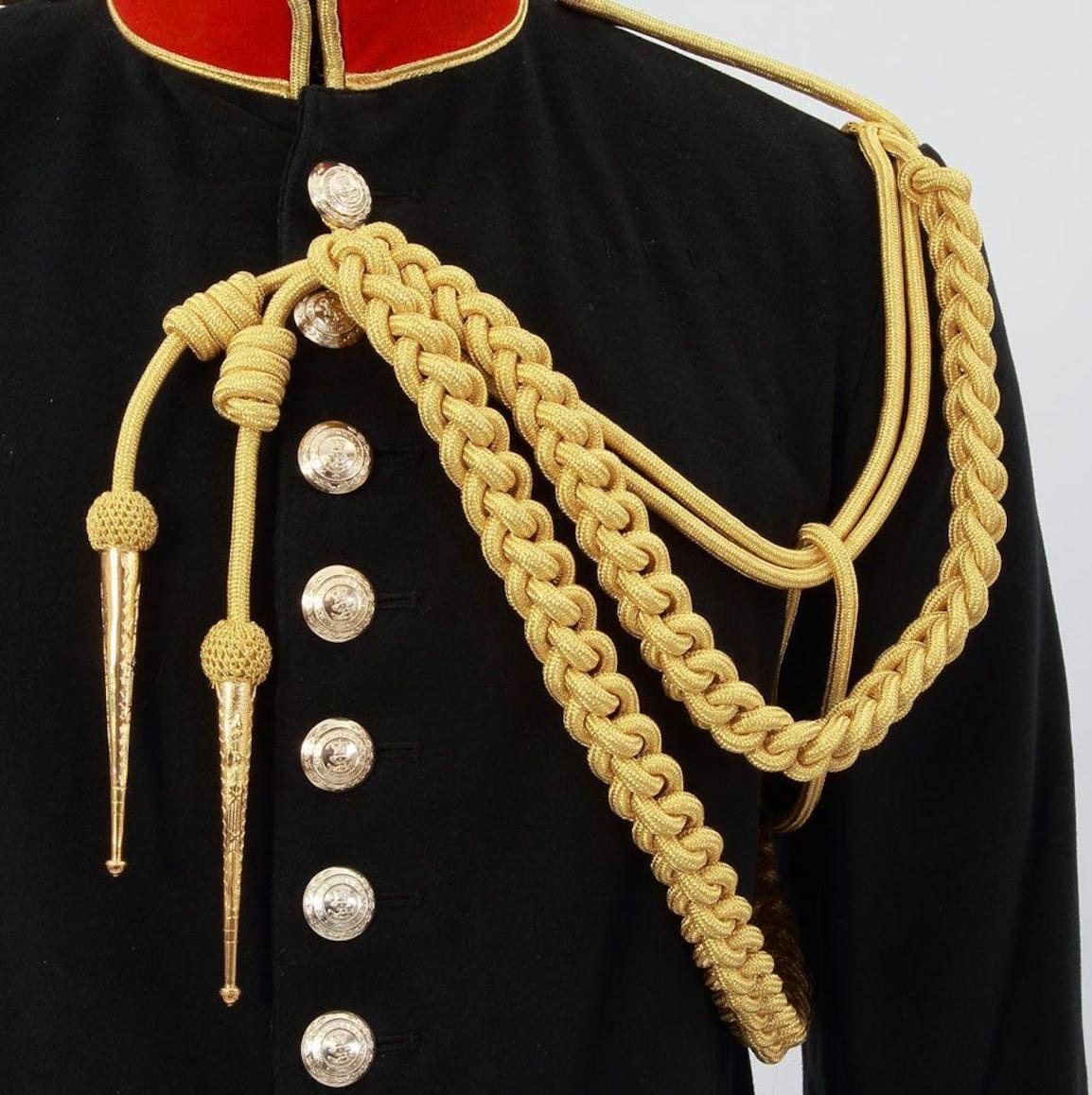 Aiguillette dressed across a ceremonial tunic